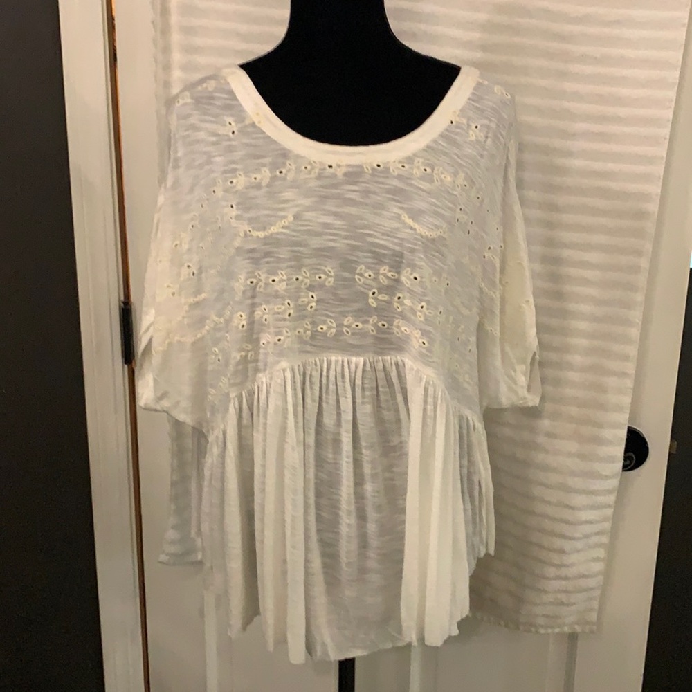 Free People ivory baby doll style oversized top.